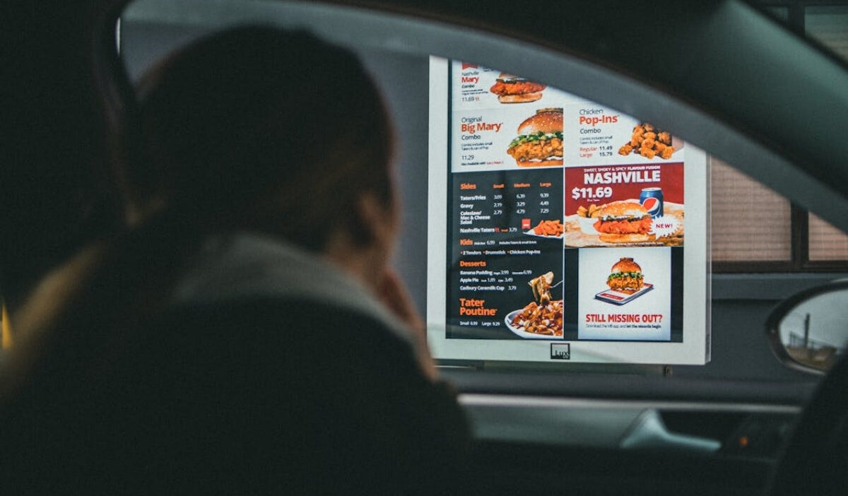 Customer ordering at fast food restaurants near me that accept EBT through a drive thru window