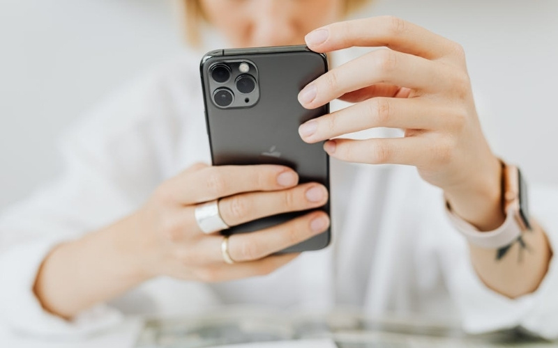 Close up of someone reviewing Lifeline details on a free government iphone 13 pro max