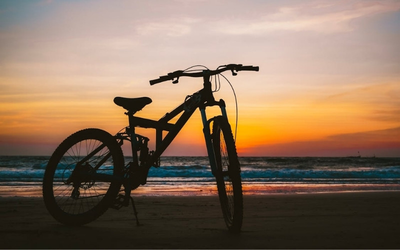 Sunset beach cycling experience highlighting fun things to do in galveston texas for outdoor lovers

Caption: