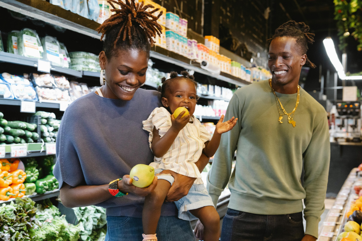 A family shopping for fresh groceries while using SNAP benefits Texas for healthy living