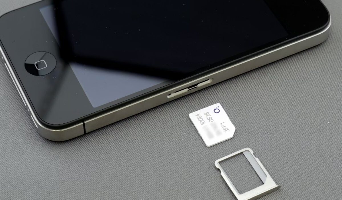 Close up of iPhone SIM tray and card illustrating iphone deals sim free network flexibility