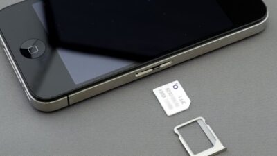 Close up of iPhone SIM tray and card illustrating iphone deals sim free network flexibility