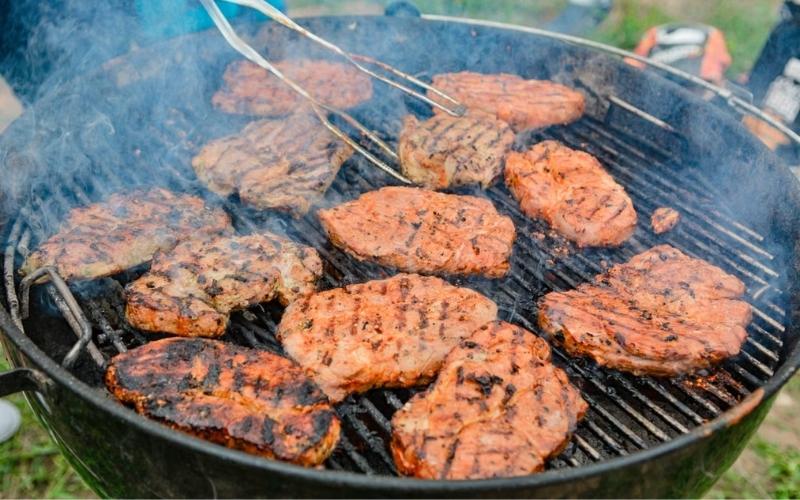 Checking pork chop temperature helps confirm how long to cook pork chops on grill