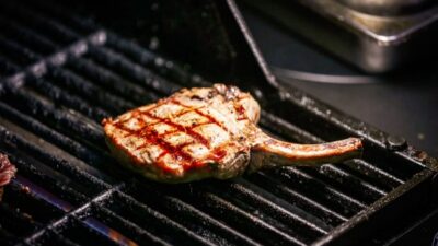 Grilled pork chops prepared with timing guidance for how long to cook pork chops on the grill