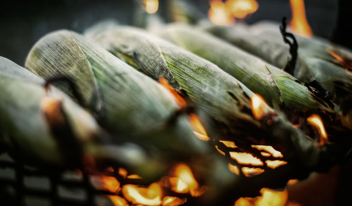 How long to grill corn in the husk for tender kernels and lightly charred flavor