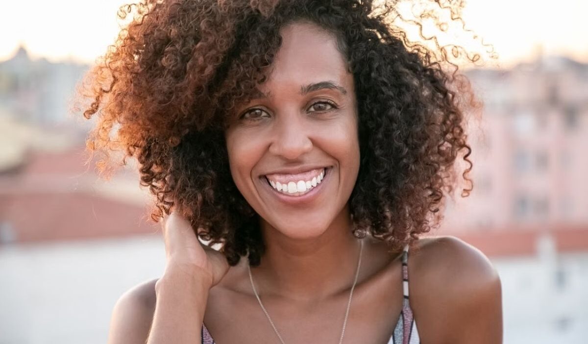 How long do perms last? Defined curls and waves showing the typical look of permed hair.
