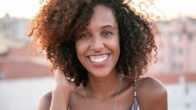How long do perms last? Defined curls and waves showing the typical look of permed hair.
